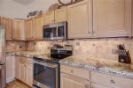 Granite countertops and high-end appliances within the newly built townhomes